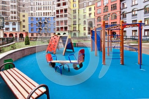 Children playground and house building exterior mixed-use urban multi-family residential district area development blue