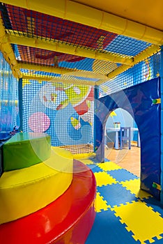 Children playground indoor. Inside the colorful plastic jungle