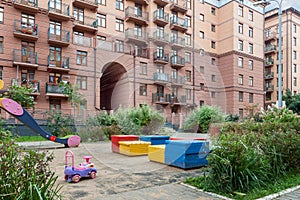 Children playground near house building exterior mixed-use urban multi-family residential district area