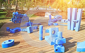 children playground in park with blue giant geometric figures for the development of imagination and spatial thinking