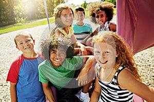 Children, playground and portrait of group in summer to relax with friends at park on vacation. Happy, holiday and kids