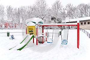 Children Playground In Winter Snow