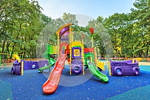 Children playground on yard activities in public park.