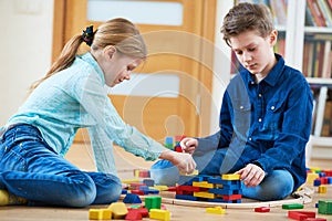 Children playing with blocks indoors