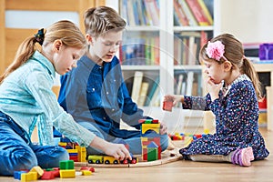 Children playing with blocks indoors
