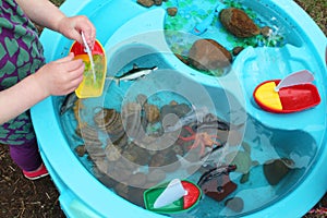 Children Playing with Boats and Sea Creature/Ocean Life Toys in a Water Table