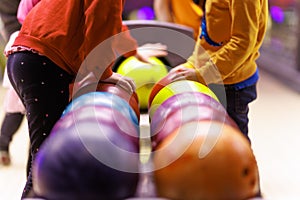 Children are playing bowling. Extracurricular activities for children