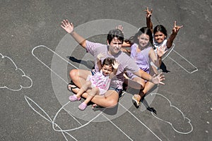 Children playing in a chalk airplane