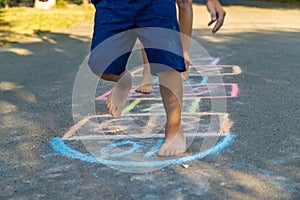 children playing classics on the playground outdoors, children outdoors. Selective focus