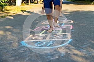 children playing classics on the playground outdoors, children outdoors. Selective focus