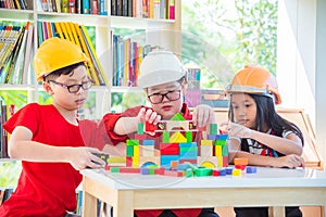 Children playing construction wood block
