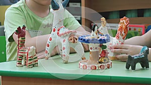 Children playing in a decorated crafts of clay