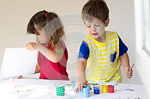Children playing and drawing at home or kindergarten or playschool