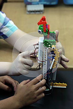 Children playing with an erector set