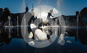 Children playing in a fountain