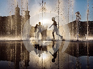 Children playing in a fountain