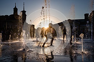 Children playing in a fountain