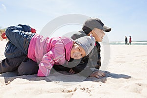 Children playing fun emotional beach