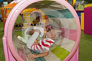 Children playing and having a good time in kids zone in amusemen