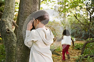 Children playing hide and seek photo
