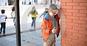 Children playing hide and seek in the schoolyard photo