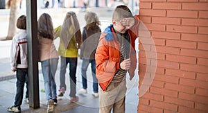 Children playing hide and seek in the schoolyard photo