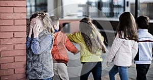 Children playing hide and seek in the schoolyard photo