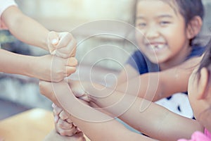 Children playing and holding hands together