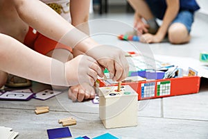 Children playing with homemade educational toys