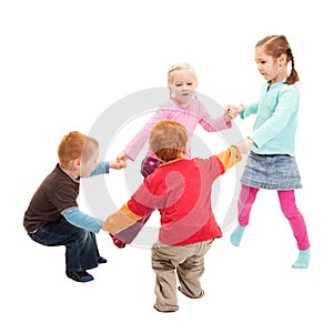 Children playing kids game holding hands in circle