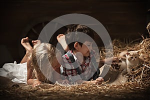 Children playing with a kittens