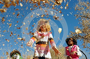 Children playing in leaves