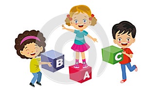 Children playing with letter cubes in the classroom are learning letters