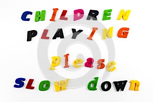 Children playing message slow down