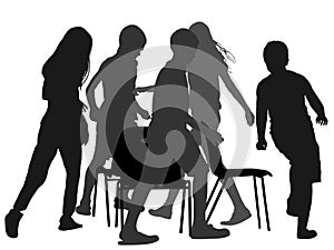 Children playing music chair game, silhouette.