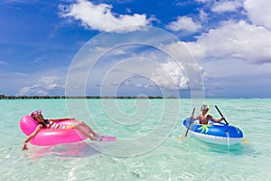 Children playing in ocean