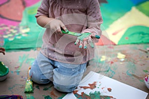 Children playing with paints and tempera