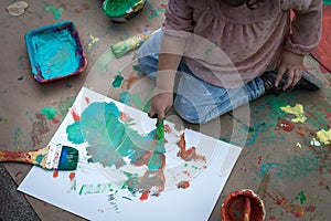 Children playing with paints and tempera