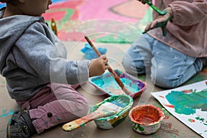 Children playing with paints and tempera