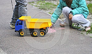 Children playing on the pavement.