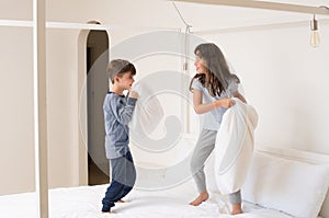 Children playing pillow fight