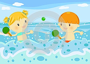 Children playing rackets in the sea