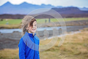 Children, playing on a road near non active vulcano in Snaefellsjokull National Park