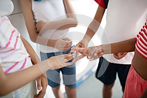 Children playing rock papers scissors while having controversy