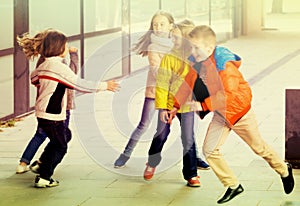 Children playing romp game Touch-last