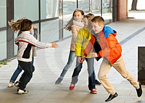 Children playing romp game Touch-last