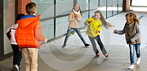Children playing romp game Touch-last photo