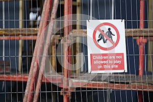 Children playing on scaffold not allowed safety sign at construction building site