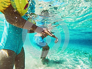 Children playing in sea