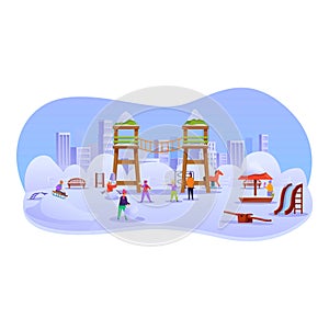 Children playing in the snow making a snowman in a city park playground photo